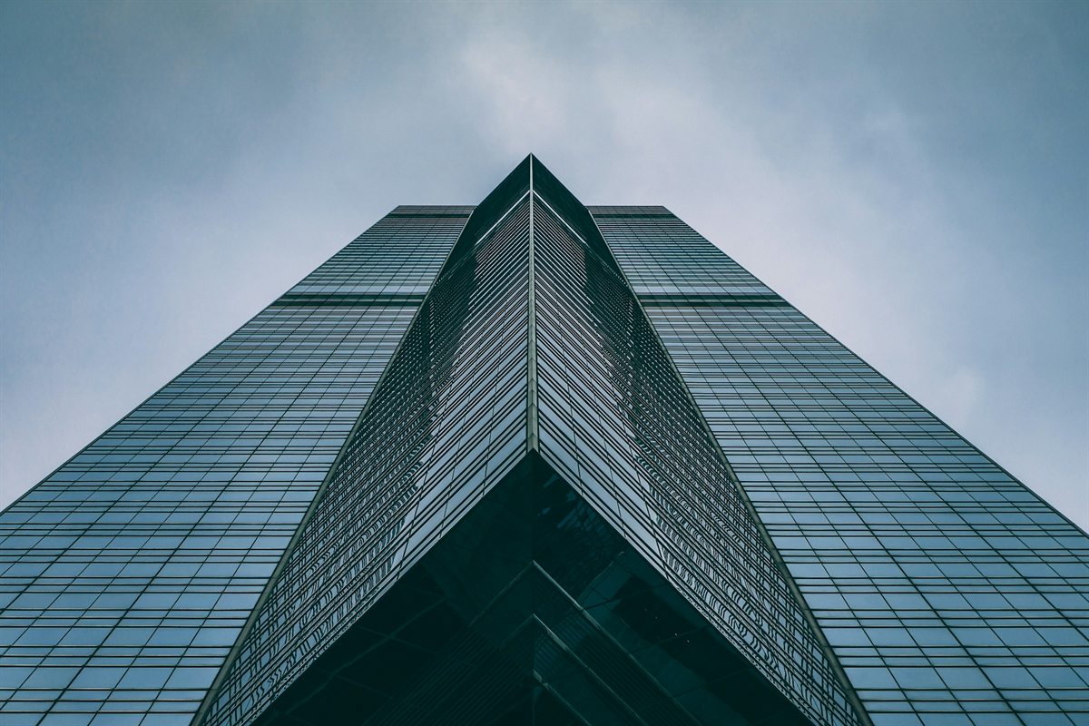 Looking up at the glass apex of a tower