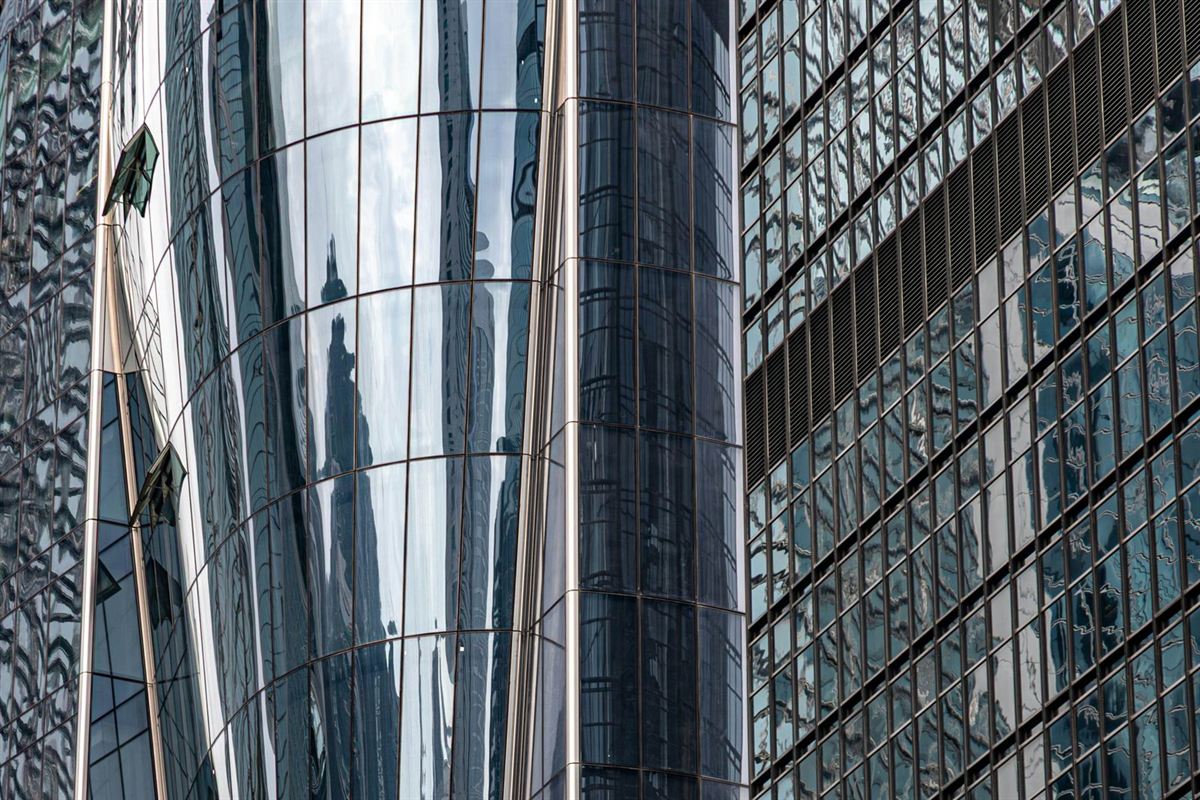 Curved glass curtain walls of neighbouring towers